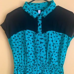 teal and black rockabilly style dress. sheer black around collar (which buttons)